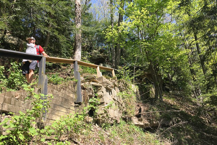 A dad and baby hike Henry Church Rock Loop trail.